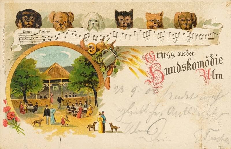 Postkarte, auf der sechs Hunde gezeichnet sind. Außerdem der Schriftzug: "Gruß aus der Hundskomödie Ulm"